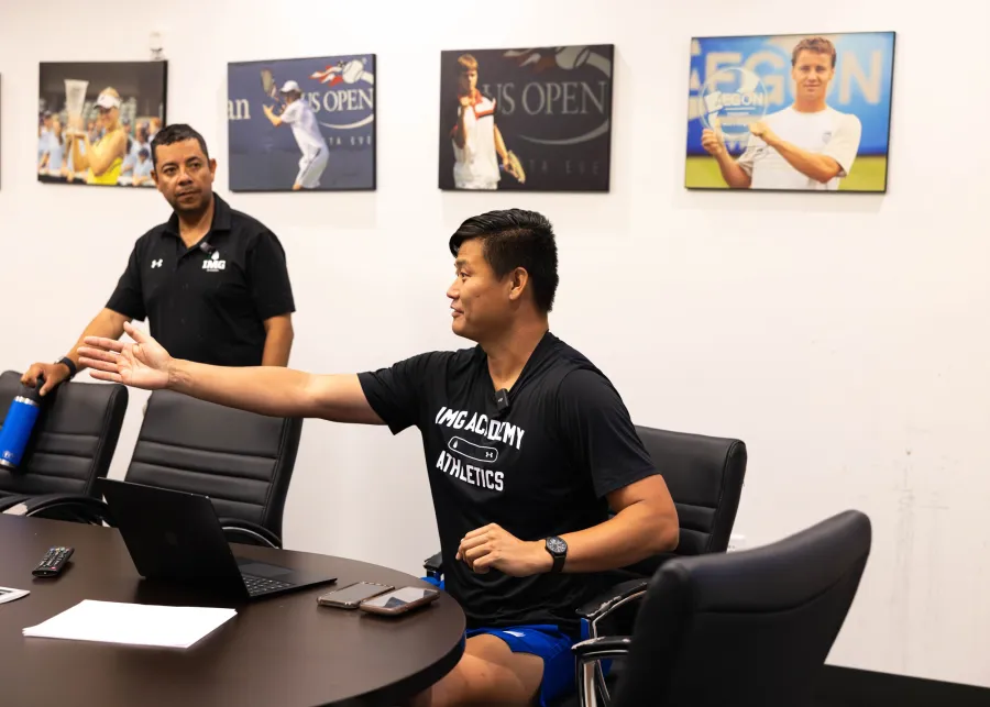 Athlete using IMG Academy digital training platform on tablet